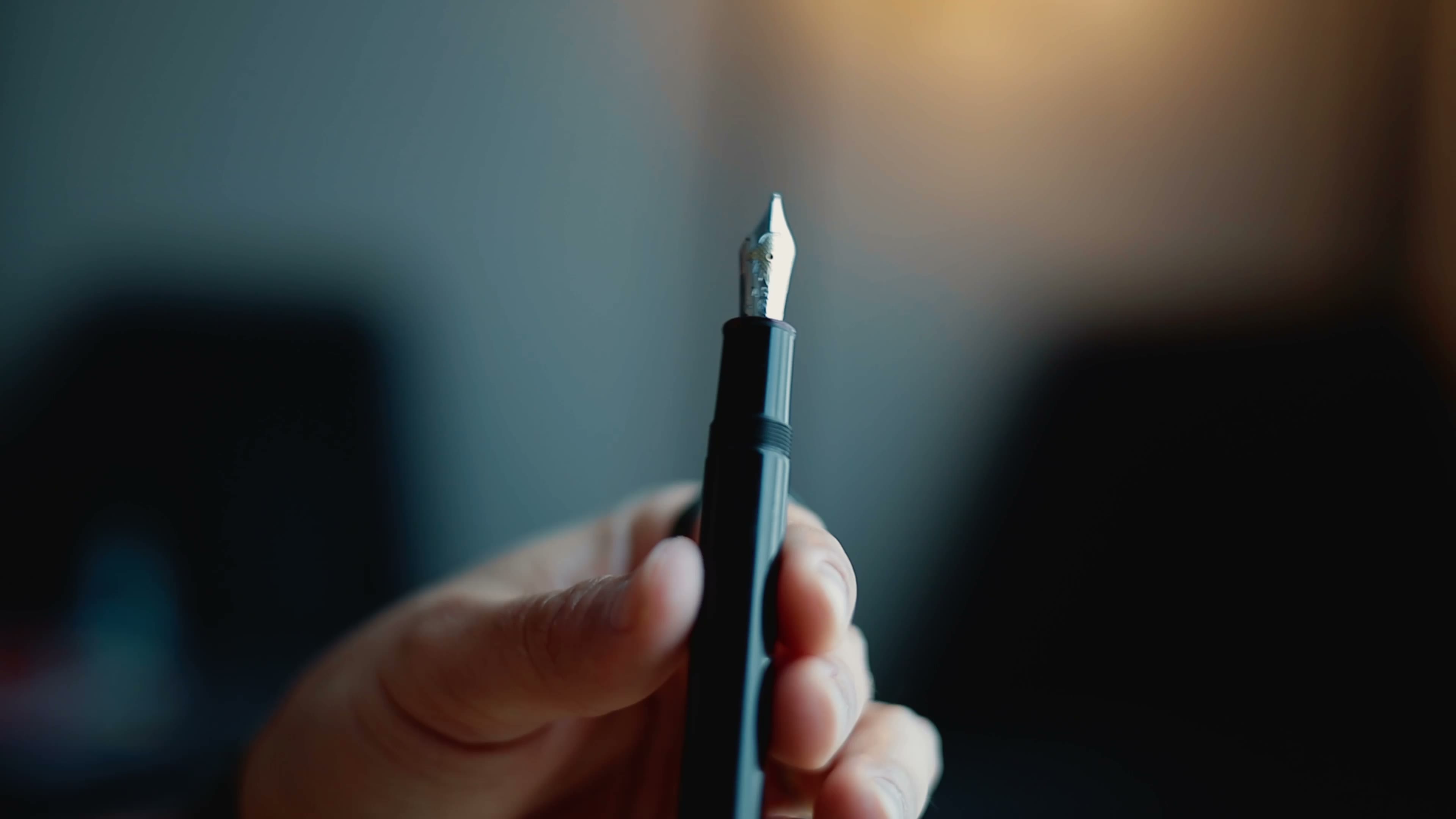 Montblanc. Black fountain pen; nib toward camera; shallow DOF.